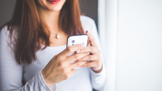 mom using phone to record baby memories