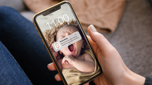 mom receiving notification on phone for baby book app