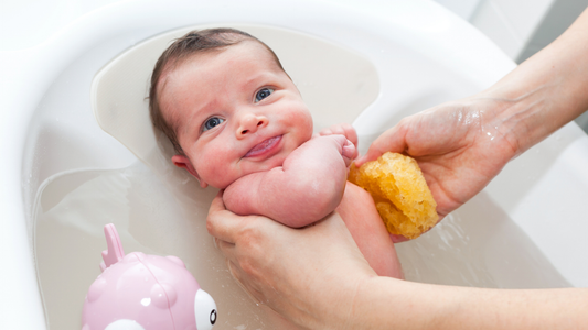 baby enjoying first bath